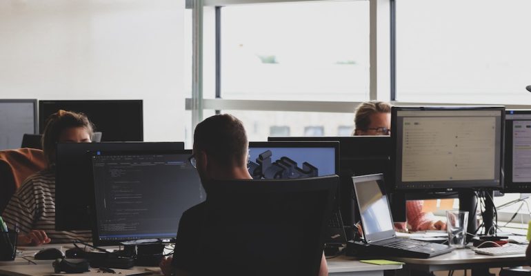 a team conducting a dark web scan in the office
